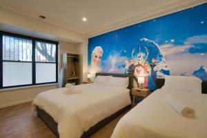 two beds in a room with a painting on the wall at Dreamy Stays Accommodation - Private Rooms with Shared Bathrooms in Adelaide +58 photos