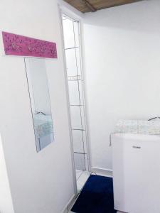 a room with a ladder and a mirror on the wall at SUITES COR DO SOL TRINDADE in Trindade +41 photos