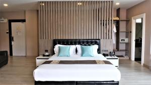 Voodi või voodid majutusasutuse KTK Pattaya Hotel & Residence toas