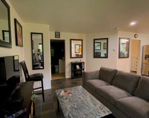 A seating area at Precision Lodge - Three one bedroom units and two rooms in a shared house - DISCOUNT ON TOURS!