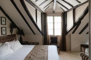 Postelja oz. postelje v sobi nastanitve Hotel Saint-Louis Marais