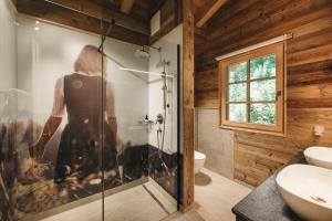 a bathroom with a glass shower and a toilet at Sporer-Alm in Rohrberg