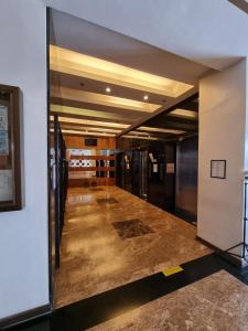 an empty hallway in a building with a room with at Fullhouse Staycation in Tagaytay