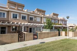 a large house with a fence in front of it at Chalet Coral Denia in Denia
