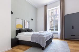 Postel nebo postele na pokoji v ubytování limehome Baden-Baden Bäderstraße