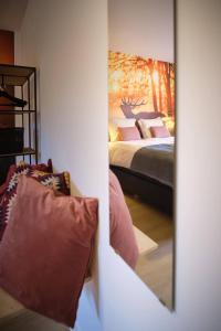 Ein Bett oder Betten in einem Zimmer der Unterkunft Ferienwohnung Eschenberg