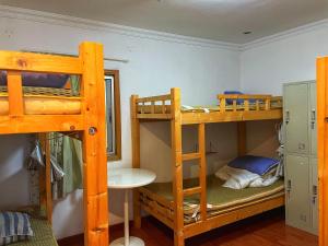 Narivoodi või narivoodid majutusasutuse Yellow House Hostel Huizhou West Lake toas