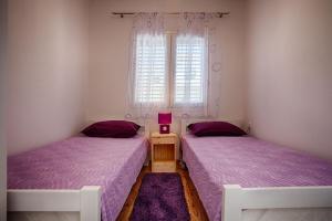 Postel nebo postele na pokoji v ubytování Apartments Dalia