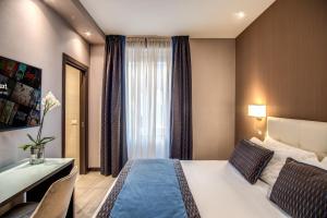 Postel nebo postele na pokoji v ubytování MZ HOTEL