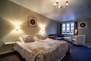 Postel nebo postele na pokoji v ubytování Hotel Allinge