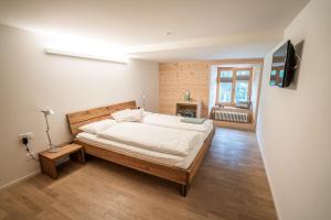 Postel nebo postele na pokoji v ubytování Hotel Wasserfall