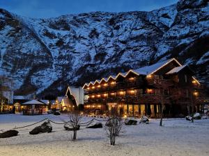 snow covered mountains and a ski lodge at Flåmsbrygga Hotel in Flåm