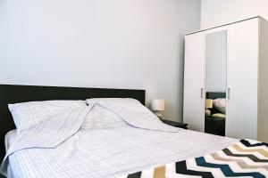 Postel nebo postele na pokoji v ubytování Apartman LUI
