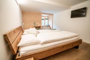 Postel nebo postele na pokoji v ubytování Hotel Wasserfall