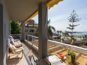 a balcony with a view of the ocean at FIRST LINE MOGAN BEACH - Parking free in Mogán +15 photos