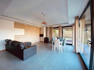 a living room with a couch and a table at Dobau casas in Vieira do Minho