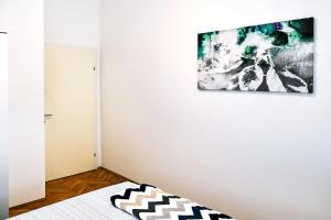 Кровать или кровати в номере Apartman LUI