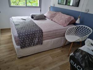Rúm í herbergi á Paulista Flat Hotel