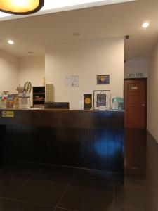 an office with a reception desk and a counter at SO Hotel in George Town