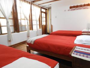 Voodi või voodid majutusasutuse Picaflor Tambo Guest House toas