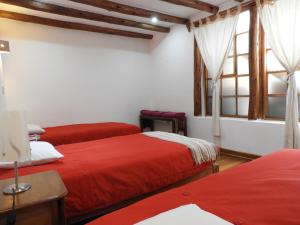 Voodi või voodid majutusasutuse Picaflor Tambo Guest House toas