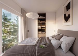 um quarto com uma cama e uma grande janela em Västös Strand by FIRST Hotels em Lärbro
