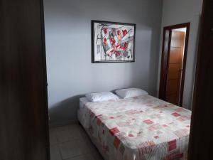 En eller flere senge i et værelse på Casa de Família