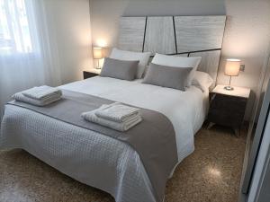 Ένα ή περισσότερα κρεβάτια σε δωμάτιο στο Apartamento Laurel