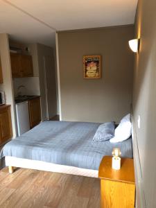 Postel nebo postele na pokoji v ubytování La Randonnée Résidence Le Bec de L'Aigle