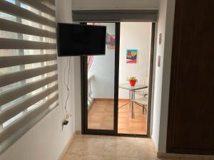 A television and/or entertainment centre at Corralejo Garden&Relax