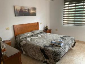 A bed or beds in a room at Corralejo Garden&Relax