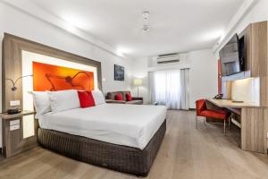 Un ou plusieurs lits dans un hébergement de l'établissement Novotel Darwin CBD