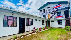 a house with a flag painted on it at Nomada's Digital in Manuel Antonio