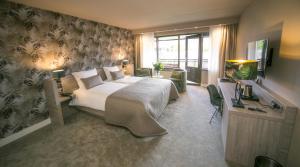 Postel nebo postele na pokoji v ubytování Van der Valk Hotel Avifauna
