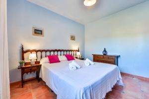 Postel nebo postele na pokoji v ubytování Villas Guzman - Petra