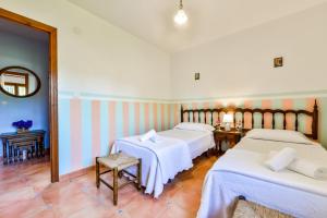Postel nebo postele na pokoji v ubytování Villas Guzman - Petra