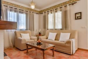 Posezení v ubytování Villas Guzman - Petra