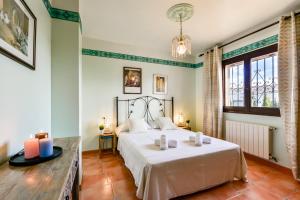 Postel nebo postele na pokoji v ubytování Villas Guzman - Petra