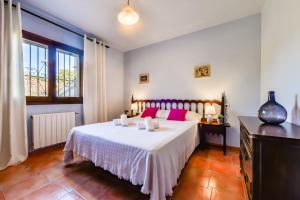 Postel nebo postele na pokoji v ubytování Villas Guzman - Petra