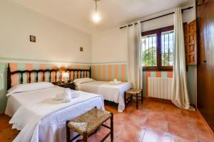 Säng eller sängar i ett rum på Villas Guzman - Petra