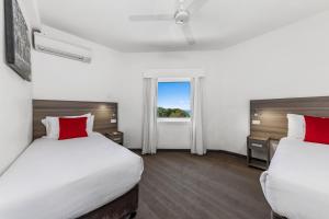 Un ou plusieurs lits dans un hébergement de l'établissement Novotel Darwin CBD