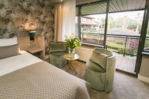 Postel nebo postele na pokoji v ubytování Van der Valk Hotel Avifauna