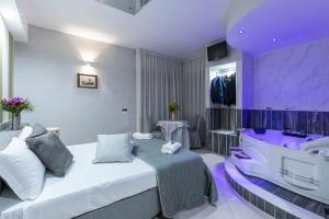 a purple room with a bed and a sink at Hotel San Paolo in Naples