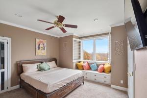 a bedroom with a bed and a window at Luxury 5 Acre Private Estate on Lake Ray Roberts in Sanger +41 photos