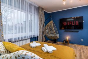 Łóżko lub łóżka w pokoju w obiekcie Exclusive Apartment Centrum 2