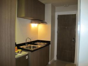 Kuchyň nebo kuchyňský kout v ubytování Zerenity Hotel & Suites