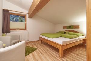 A bed or beds in a room at Auszeit-Oetztal