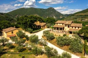 an aerial view of a village in the mountains at Agriturismo Le Vigne in Foligno