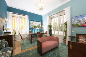 a living room with a couch and a table at Maison et studio l'Orangerie in Rome