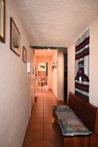 a hallway of a home with a couch and a table at Bardonecchia Appartamento XL in Bardonecchia